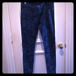 Size 8 floral pattern dark wash jeans.